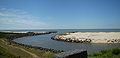 The mouth of Arroio Chuí on the Atlantic Ocean. Brazil on the left, Uruguay on the right. The stone breakwater on the left is both the southernmost and the westernmost point of the Brazilian coast; the one on the right is both the northernmost and the easternmost point of the Uruguayan coast.