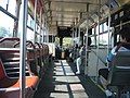 The interior of an old New Flyer trolley.