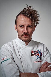 Headshot of Yevhen Klopotenko wearing a chef jacket