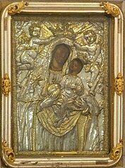 "Our Lady of the Harbor" with a painting of "Madonna and Child", framed by a silver relief