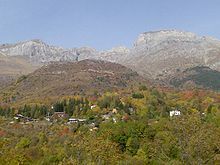 Village in autumn, with mountains in background