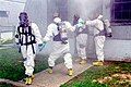 DEA agents wearing Level B hazmat suits.