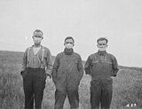 Albertan farmers wearing masks to protect themselves from the flu.