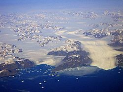 View of the two K.J.V. Steenstrup Glaciers reaching the ocean south of Ikertivaq Fjord.