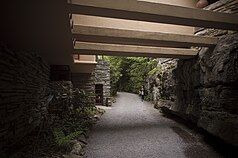 Horizontal trellis bars over Fallingwater's driveway