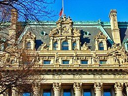 Photograph of the details of the Chambers Street facade, with dormer windows projecting from the roof