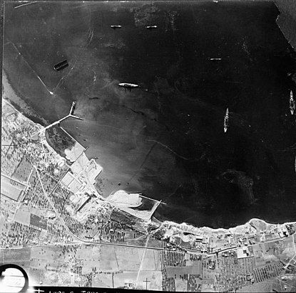 Aerial photo of Italian warships moored in Mar Grande harbour at Taranto. Note the 'Y' jetty.