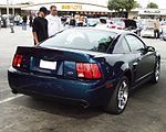 The rear of a 2004 Mystichrome Cobra coupe.