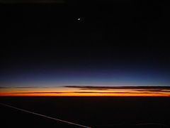 Astronomical twilight as seen from a plane window