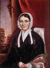 A portrait of Isabel, Mackenzie's wife. Isabel is seated in a chair facing part-way leftward.