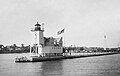 The configuration of the lighthouse from 1912 - 1931, with an open frame tower and the fog signal building behind it. This photo was taken in 1914 when the fog signal was a 10" diameter compressed air whistle