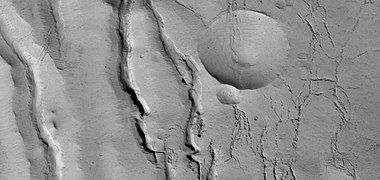 Close view of cracks of various sizes, as seen by HiRISE under HiWish program. Ice disappears along crack surfaces and makes crack larger.