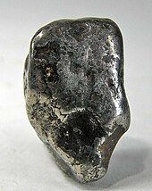 Awaruite is a nickel-iron alloy-bearing rock occurring as detritus in streams. This pebble/nugget weighs 13 grams.