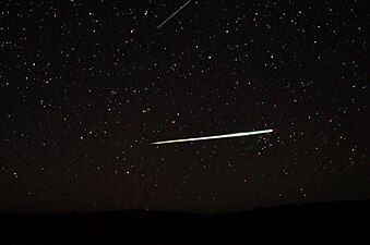 Sporadic bolide over the desert of Central Australia and a Lyrid (top edge)