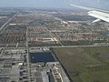 Aerial view of western Doral. Florida's Turnpike is visible in the upper left and one of the few remaining cow pastures in the Miami area is in the lower right.