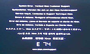 The error code E74. Above the large E 74 code is the message "System Error. Contact Xbox Customer Support." repeated in different languages.