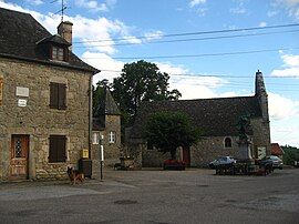 The church and surrounding buildings in Champagnac-la-Prune