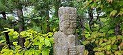 One of the many statues hidden within the plants.