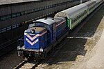 A PKP class SM42 diesel locomotive pulls a passenger train in Poland in 2011