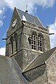 Church bell tower with dummy parachutist.