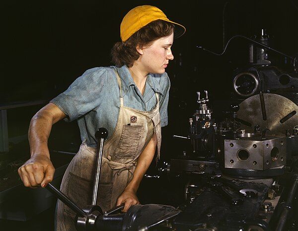 Turret lathe operator at the Consolidated Aircraft Corporation plant, Fort Worth, Texas, in 1942.