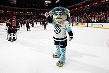 Blue-haired troll wearing a Seattle Kraken hockey jersey