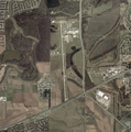 Aerial photograph of the airport and the Central Unit prison property, which is on both sides of the runway, on January 27, 2002 - U.S. Geological Survey