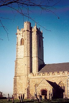 Stone building with square tower and stair turret.