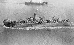 USS LSM(R)-194, of the LSM(R)-188 class, passing under the Cooper River Bridge, Charleston, SC, 2 December 1944