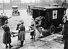 Red Cross workers remove a flu victim in St. Louis, Missouri (1918)