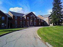 Picture of a building with a road leading up to it