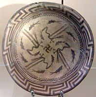 The Samarra bowl, from Iraq, circa 4,000 BCE, held at the Pergamonmuseum, Berlin. The swastika in the centre of the design is a reconstruction.[88]