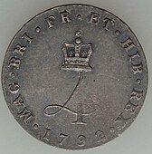 Silver coin with a design featuring a crowned numeral