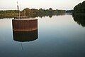 Savannah Bluff Lock and Dam; View of upstream pool north of dam. Inactive dolphins for use in barge navigation in foreground.