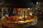 Texas-style barbecue smoke pit with various meats