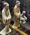 A female servant and a male advisor in Chinese shenyi, ceramic figurines from the Western Han period (202 BCE – 9 CE)