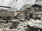 Pots and pans seen in the remains of a home burned from the fire the night after.