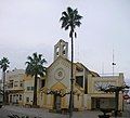 Sant Jaume d'Enveja church with its large bell-gable, Spain.