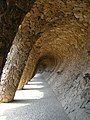 Colonnaded pathway where the road projects out from the hillside, with the vaulting forming a retaining wall which curves over to support the road, and transmits the load onto sloping columns.