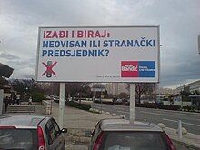 Billboard with blue and red letters on white background