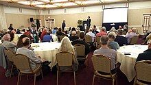 NOCIRC 15th International Symposium on Genital Integrity attendees watching a presentation, San Francisco, 2018