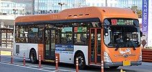 Orange-and-white bus