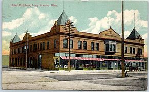 Hand-tinted postcard of the Hotel Reichert circa 1910, showing the former pyramidal corner towers