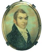 A locket containing a miniature portrait of a man in a suit