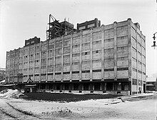 The Buffalo, Rochester and Pittsburgh Railway passenger station was south of the railroad tracks. The freight station, shown here in 1914 during construction, was built between the north side of the tracks and the Erie Canal at 25 Oak Street, opposite the passenger station.