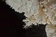 Aragonite frostwork is another speleothem found throughout the cave, typically in small crusts on the walls.