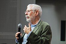 Steve Blank standing and giving a lecture at Stanford University in 2024