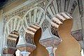 Caliphal-style arches of the Taifa palace (11th century) in the Alcazaba of Málaga, Spain