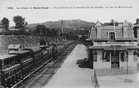 A train stopped in front of the passenger building.