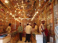 Several men inside a traditional bangle shop in the market.